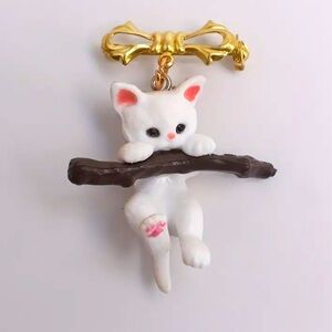Brooch- white kitty hanging from branch. Enamel paint, NIP, 1.5” x 2”